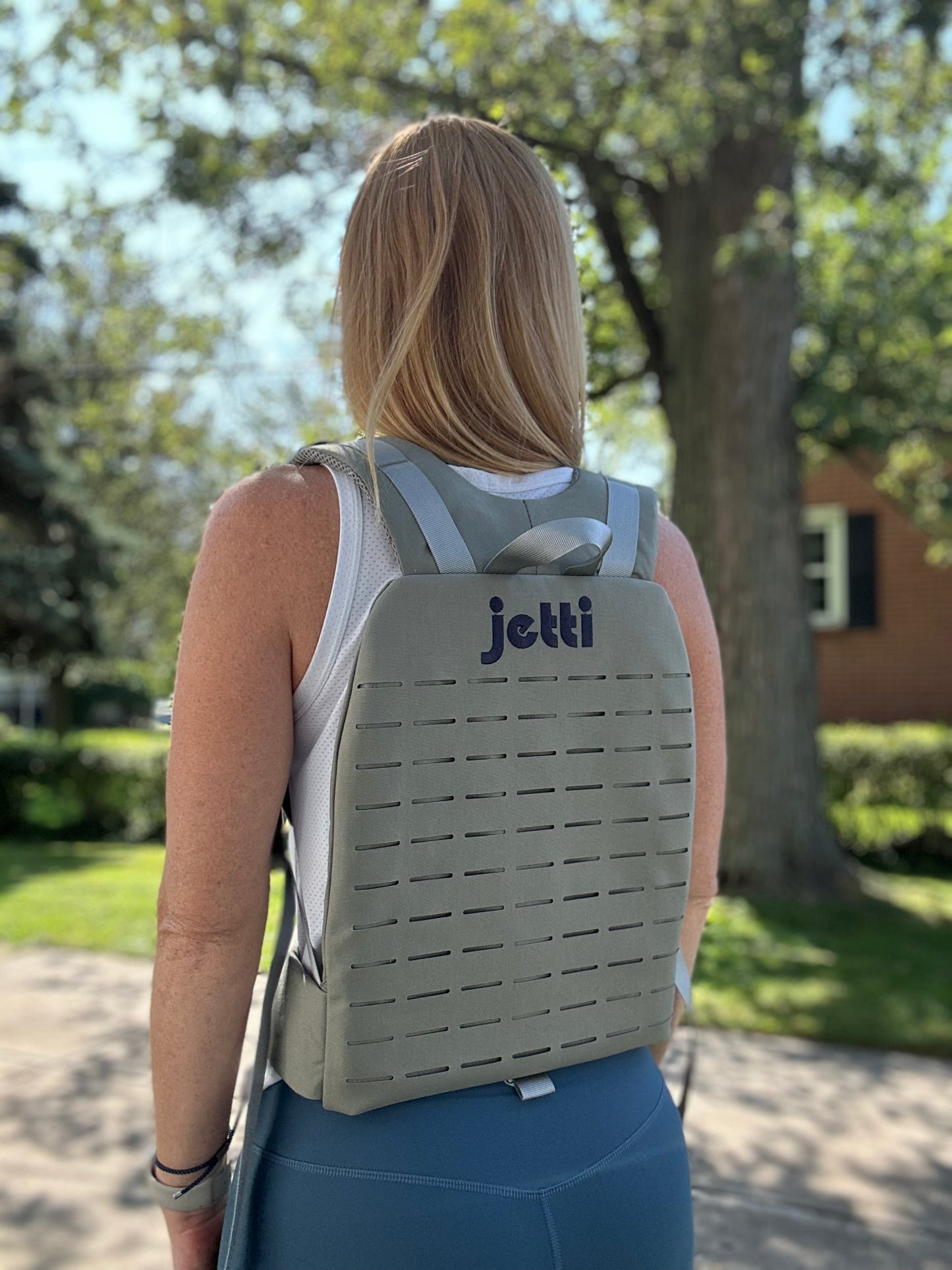 Woman wearing gray Jetti Pack for women rucking